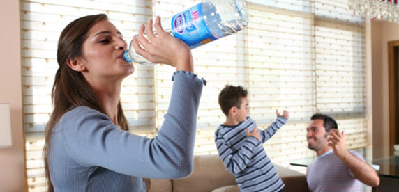 woman drinking Nestlé Pure Life