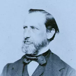 Vintage portrait of Henri Nestlé, founder of Nestlé, in a dark jacket and bow tie